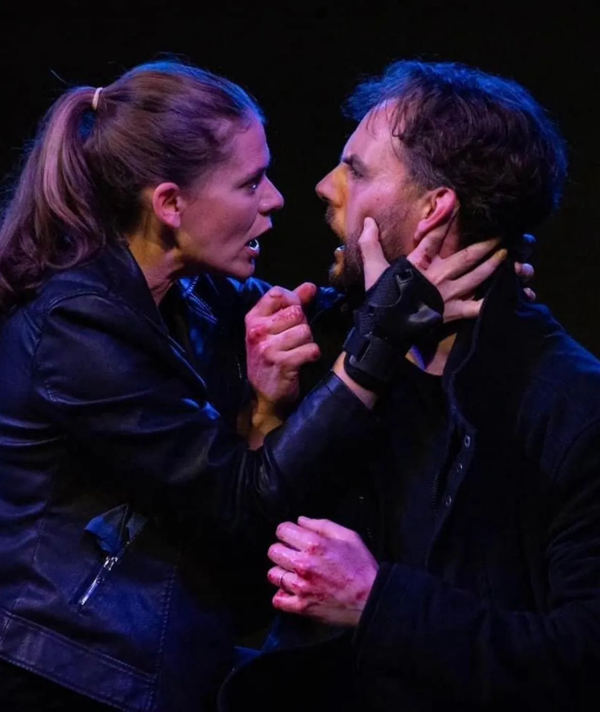 Danny Solomon on stage — tense confrontation, blood on hands