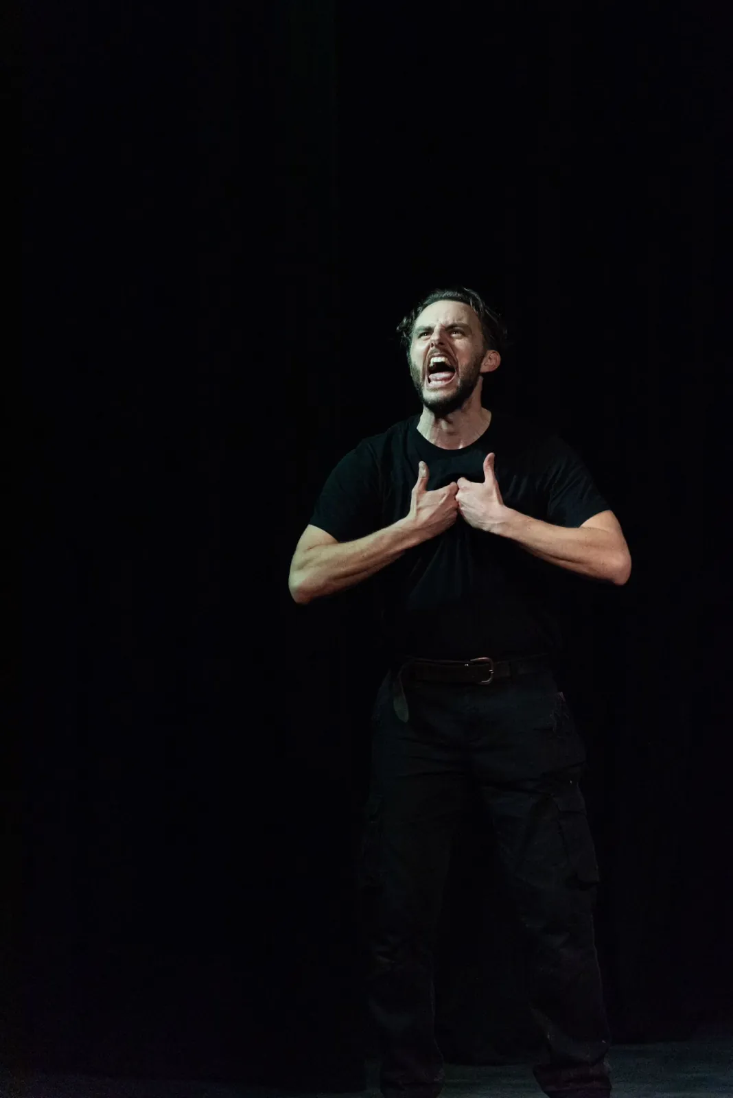 Danny Solomon on stage — shouting, hands on chest