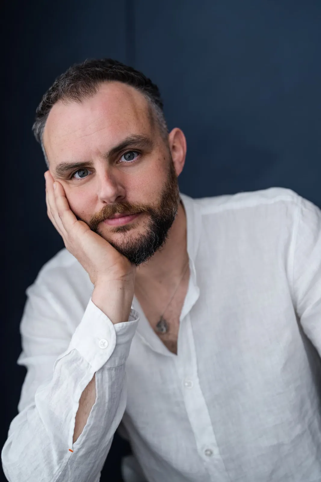 Danny Solomon headshot — white linen shirt